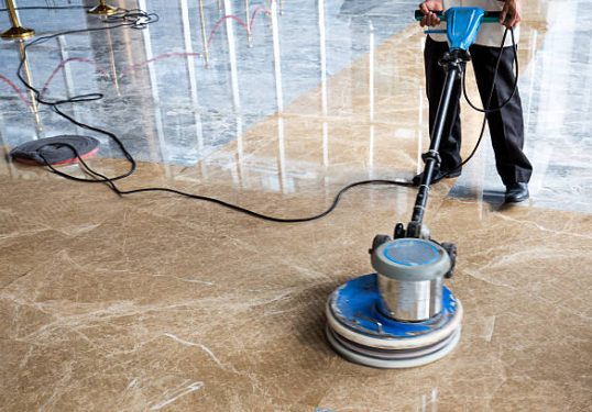 people polishes floor indoors